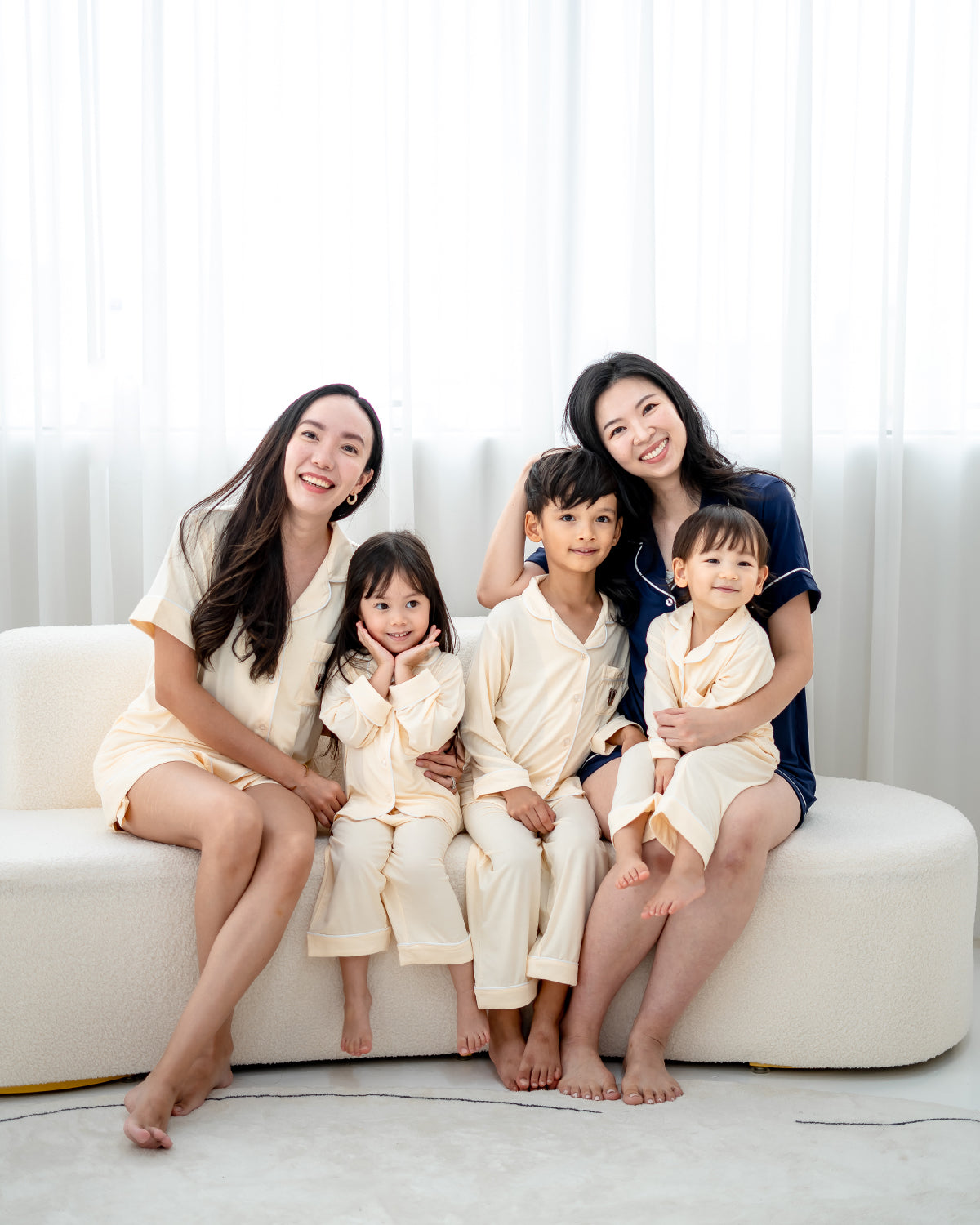 Family matching pyjamas in cream and navy made from OEKO-TEX® certified bamboo fabric, soft breathable and sustainable sleepwear