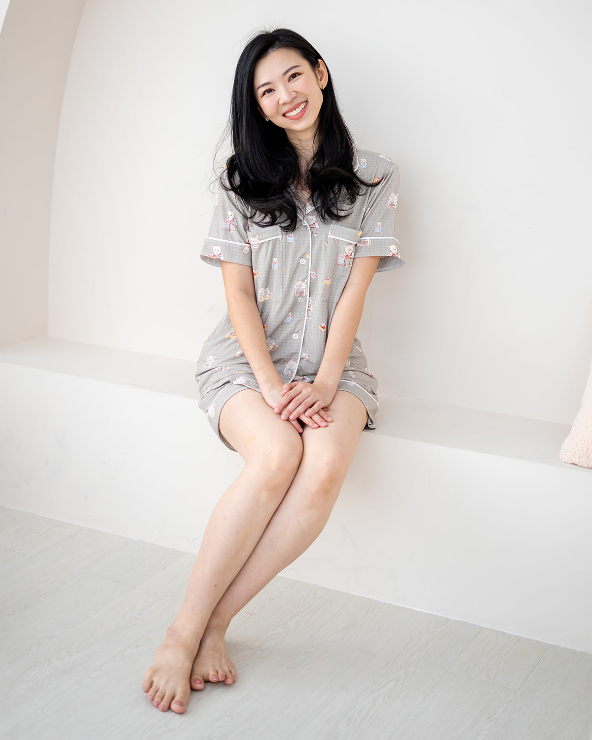 Model sitting comfortably in LeBear Bearista adult bamboo pyjamas made from buttery-soft bamboo fabric.