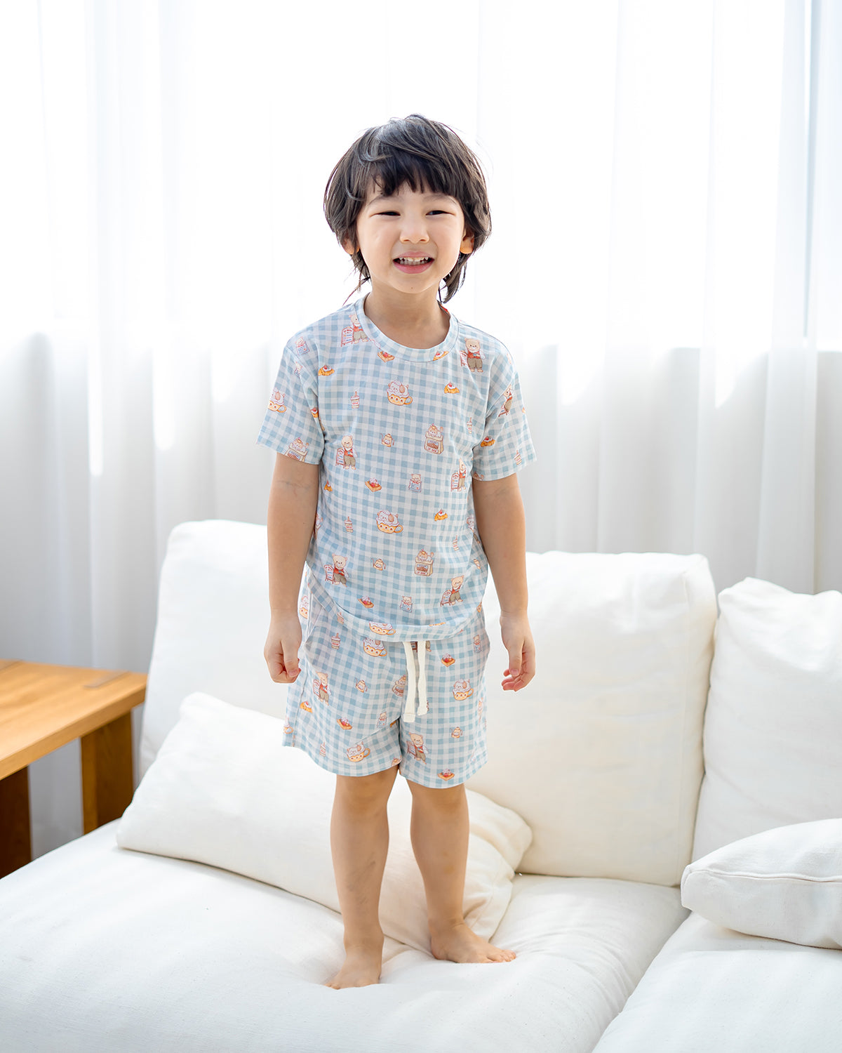 Front view of LeBear Bearista Bluebell Gingham kids bamboo lounge set featuring a café-inspired bear print and relaxed fit.