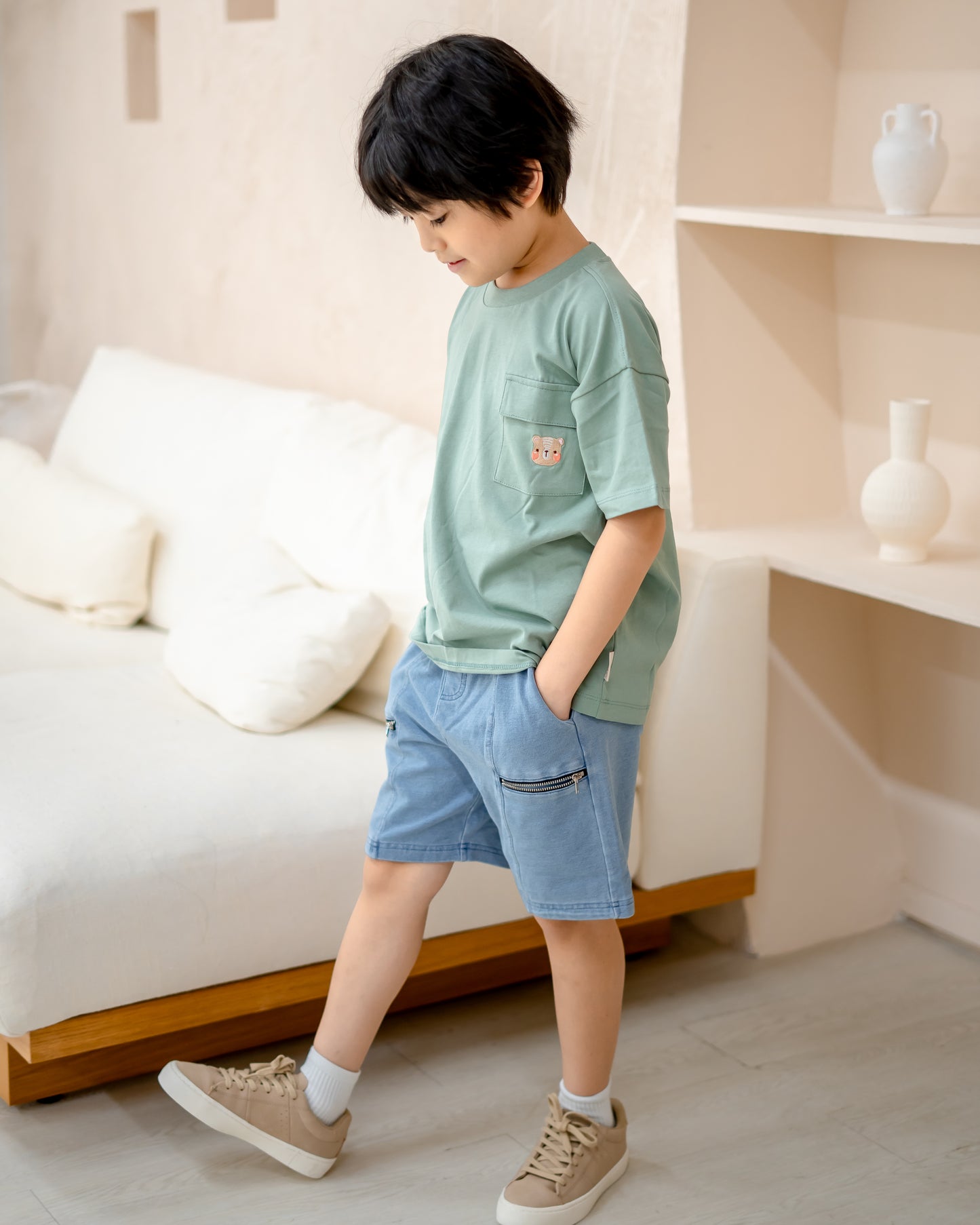 LeBear kids light wash denim shorts in soft stretchable denim, side view highlighting relaxed fit and zipper detail