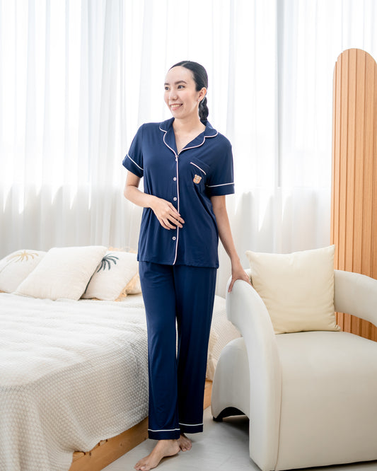 Woman in LeBear Luxe Comfort pyjamas set navy, OEKO-TEX® certified bamboo, elegant breathable sleepwear for women