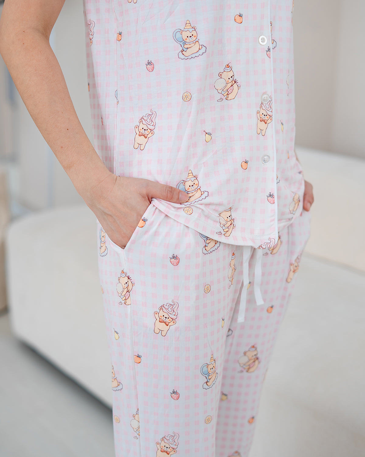 Close-up of LeBear Sweet Scoop adult bamboo pyjamas showcasing the exclusive ice cream teddy bear print on pink gingham bamboo fabric.