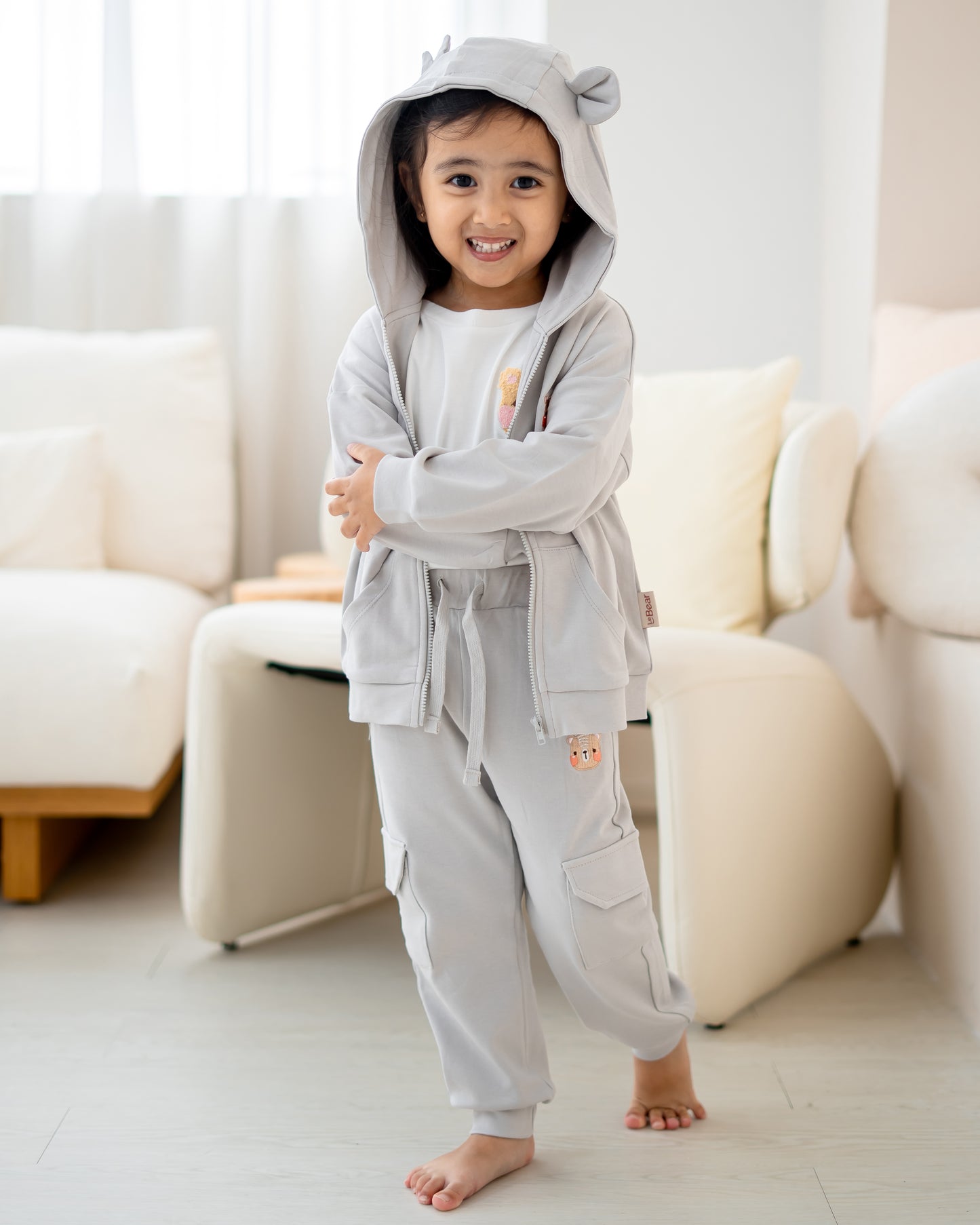 Voyabear embroidery detail on LeBear kids hooded jacket cloud grey