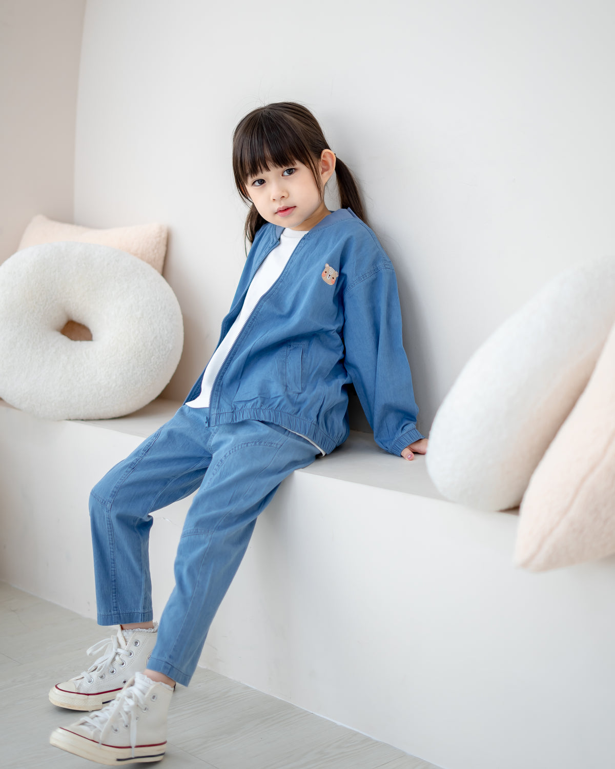 LeBear kids denim bomber jacket featuring signature bear embroidery and front pockets