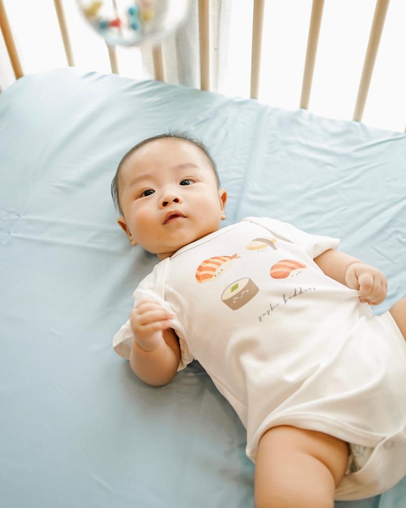 Oak and Sand Baby Cot Sheet in Gentle Sky Blue LeBear