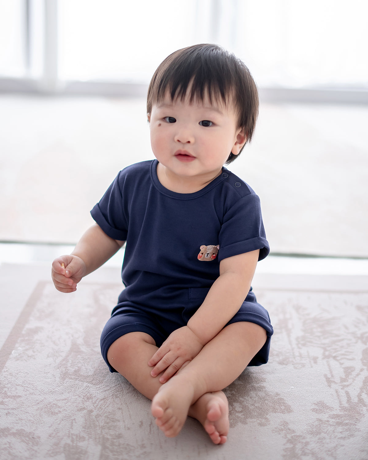 LEBEAR SIGNATURE EMBROIDERY ONESIE IN DEEP SEA BLUE