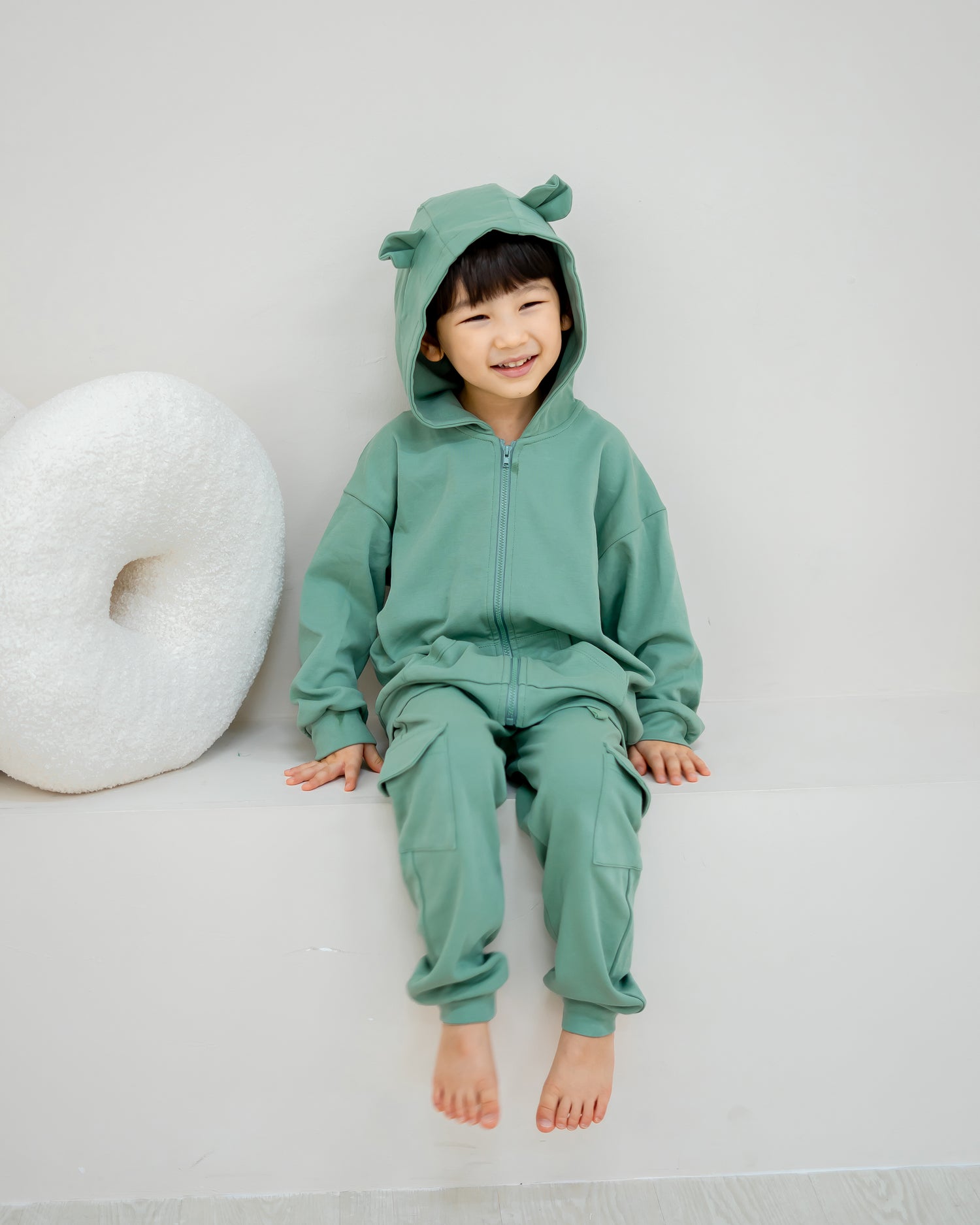 VOYABEAR HOODED JACKET IN PINE GREEN