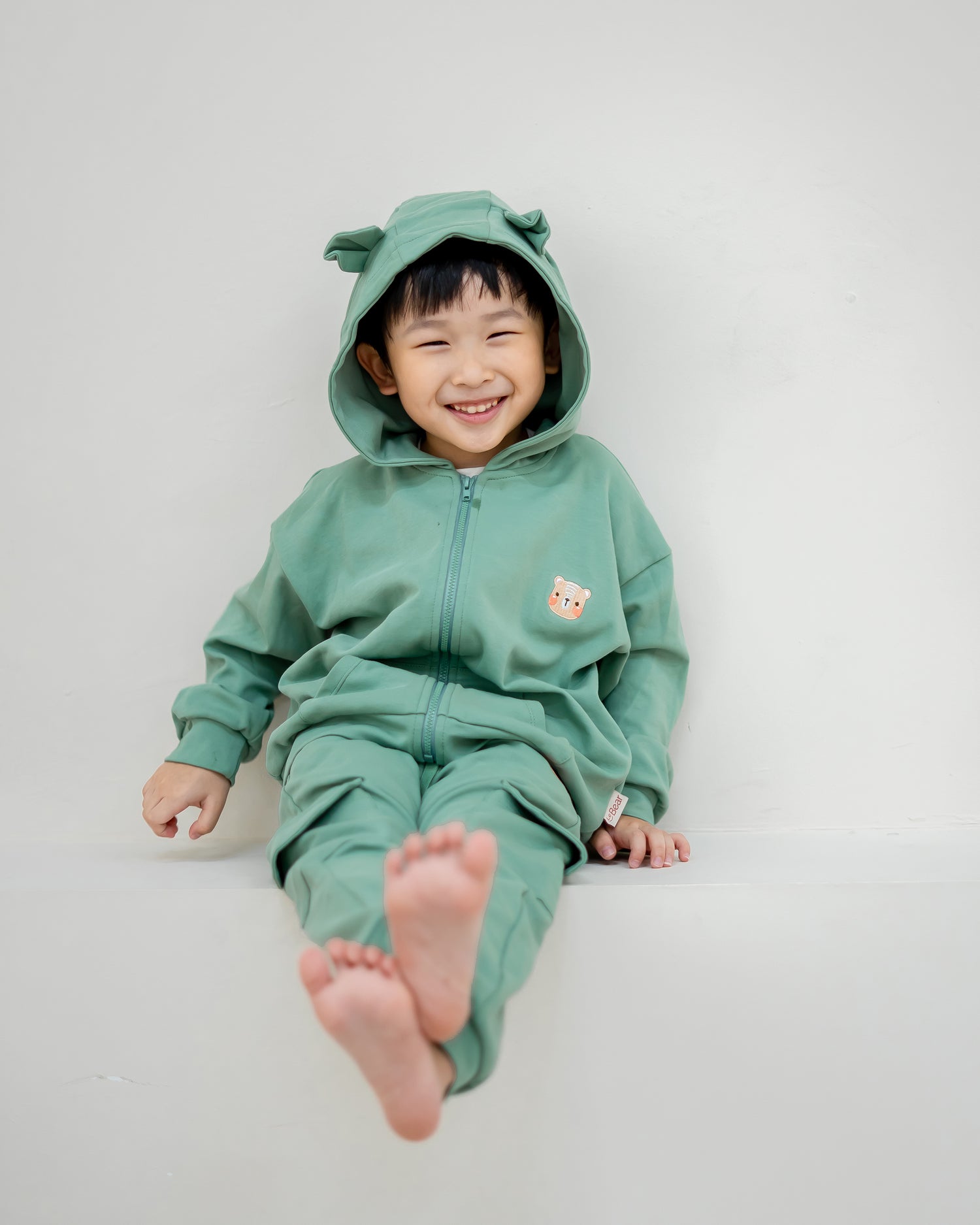 VOYABEAR HOODED JACKET IN PINE GREEN