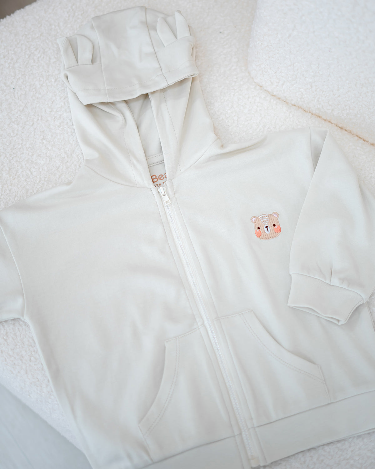 VOYABEAR HOODED JACKET IN SAND BEIGE