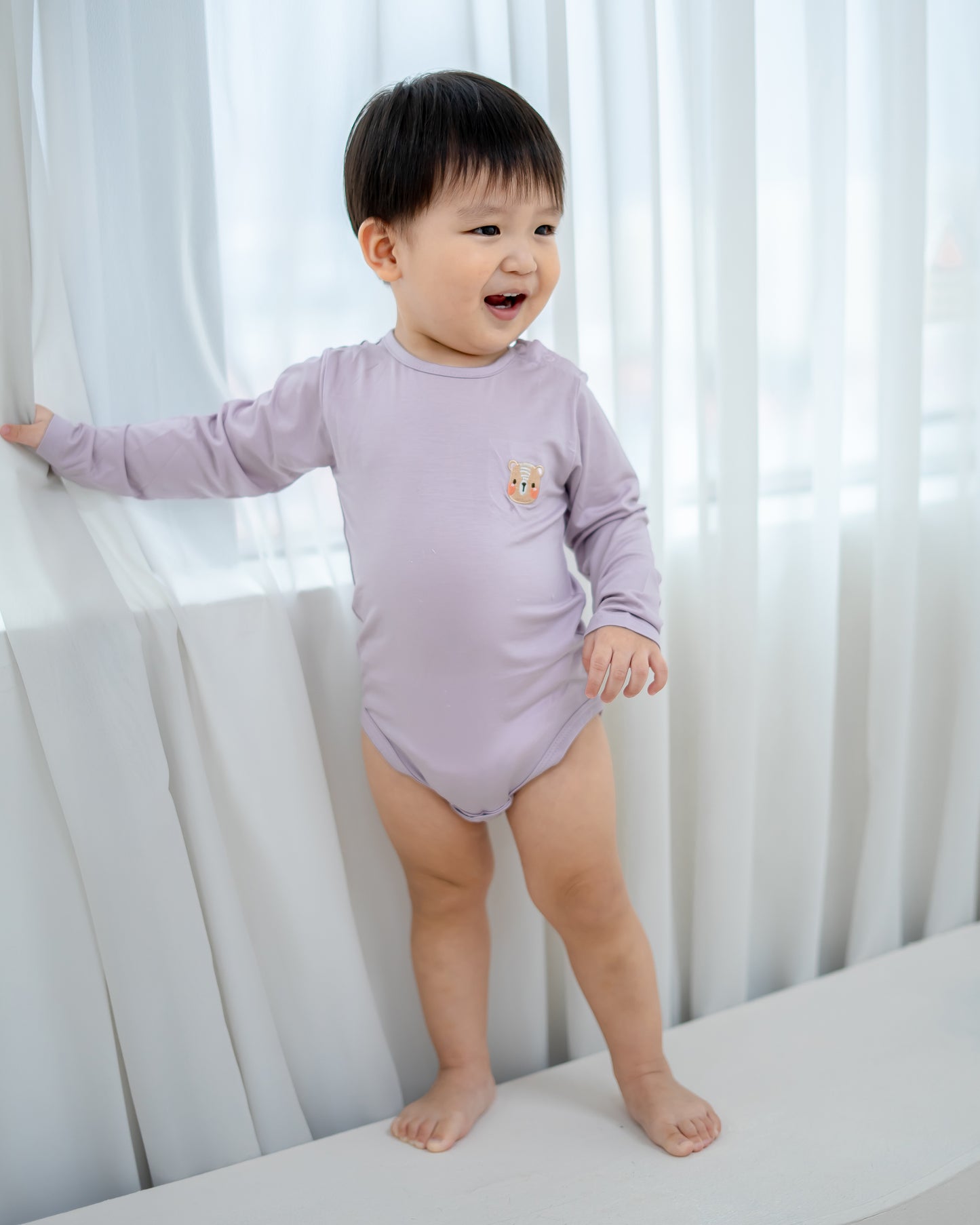 LEBEAR TENCEL™ LONG SLEEVE ONESIE IN LILAC