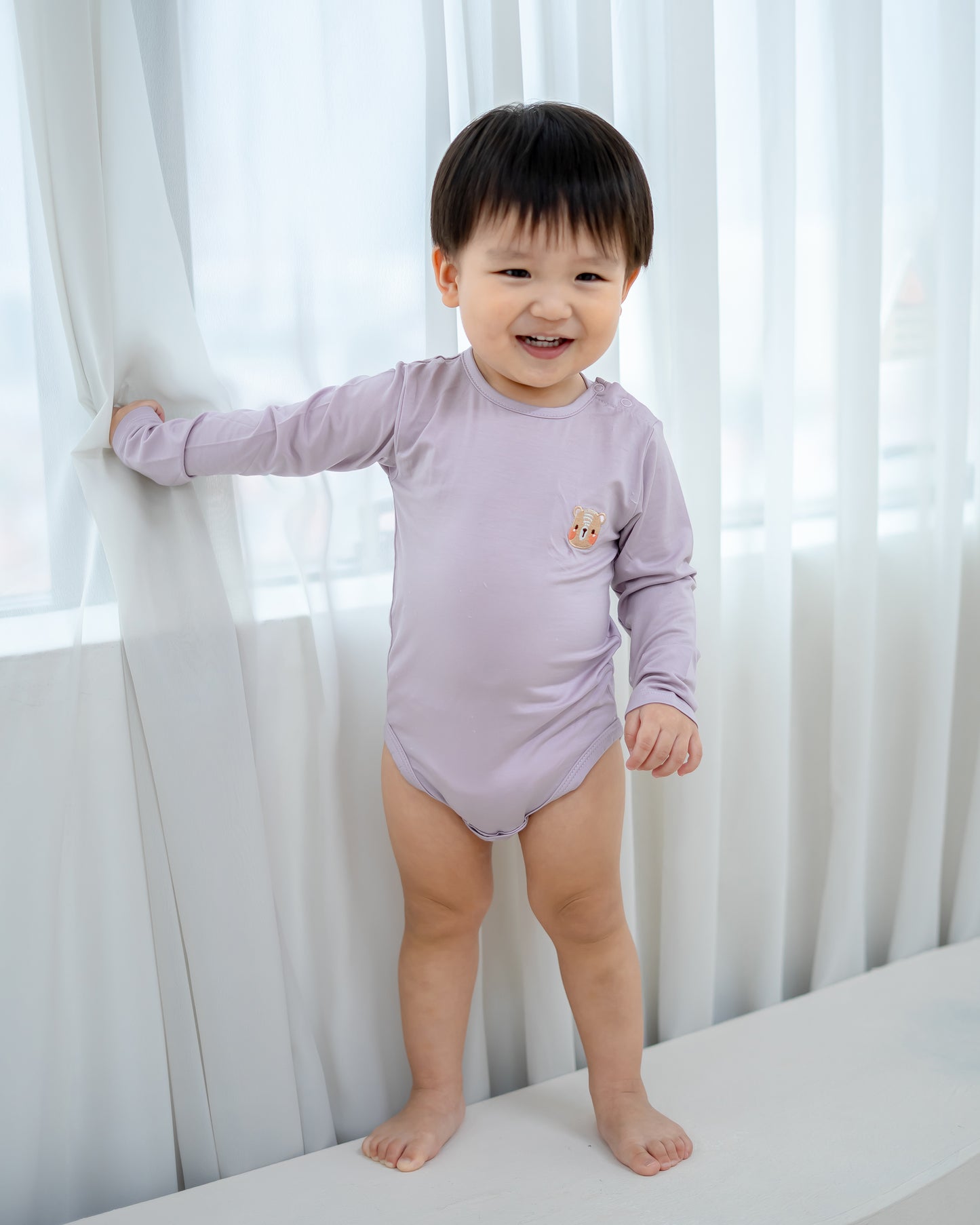 LEBEAR TENCEL™ LONG SLEEVE ONESIE IN LILAC