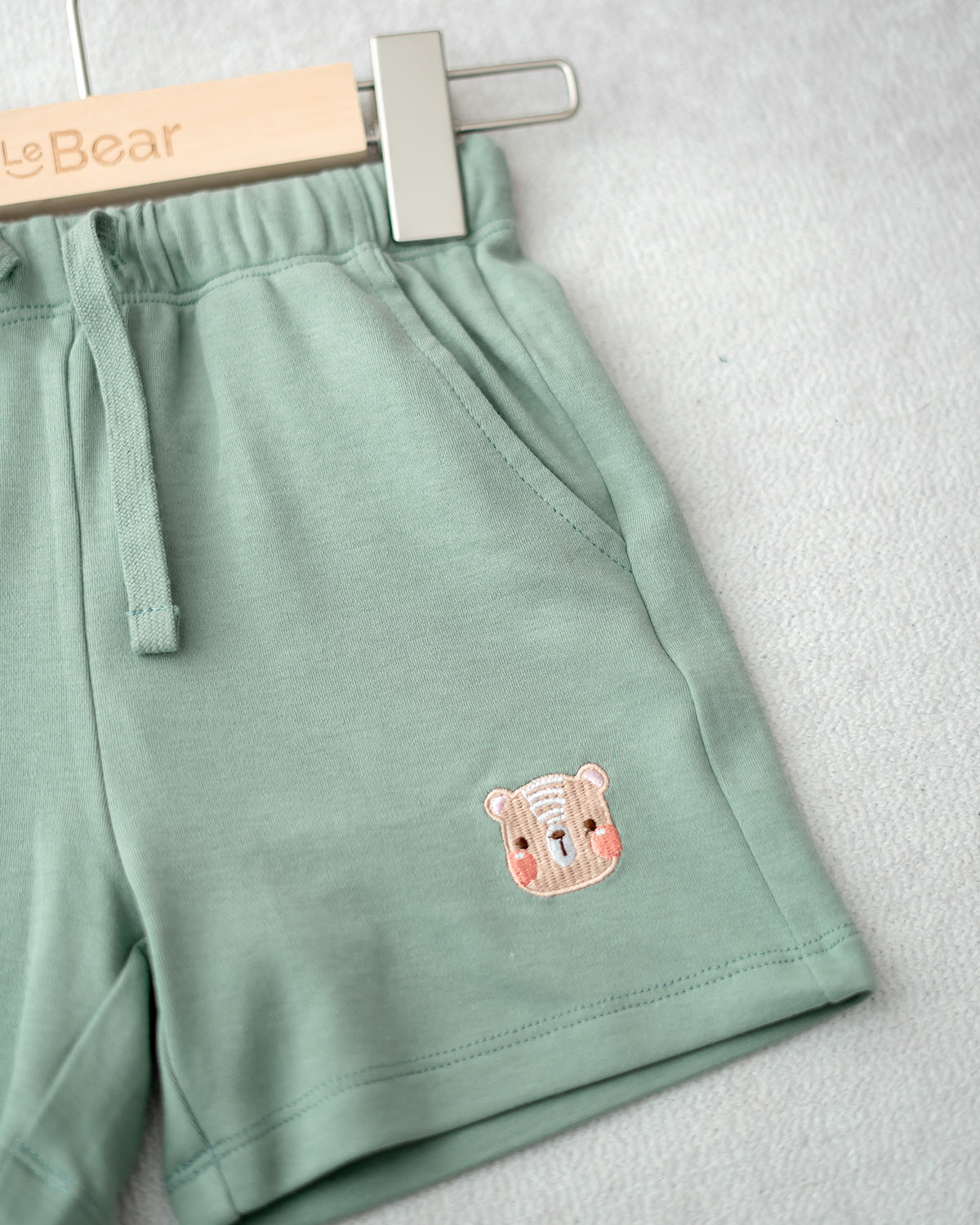 LEBEAR EMBROIDERY JOGGER SHORTS IN PINE GREEN