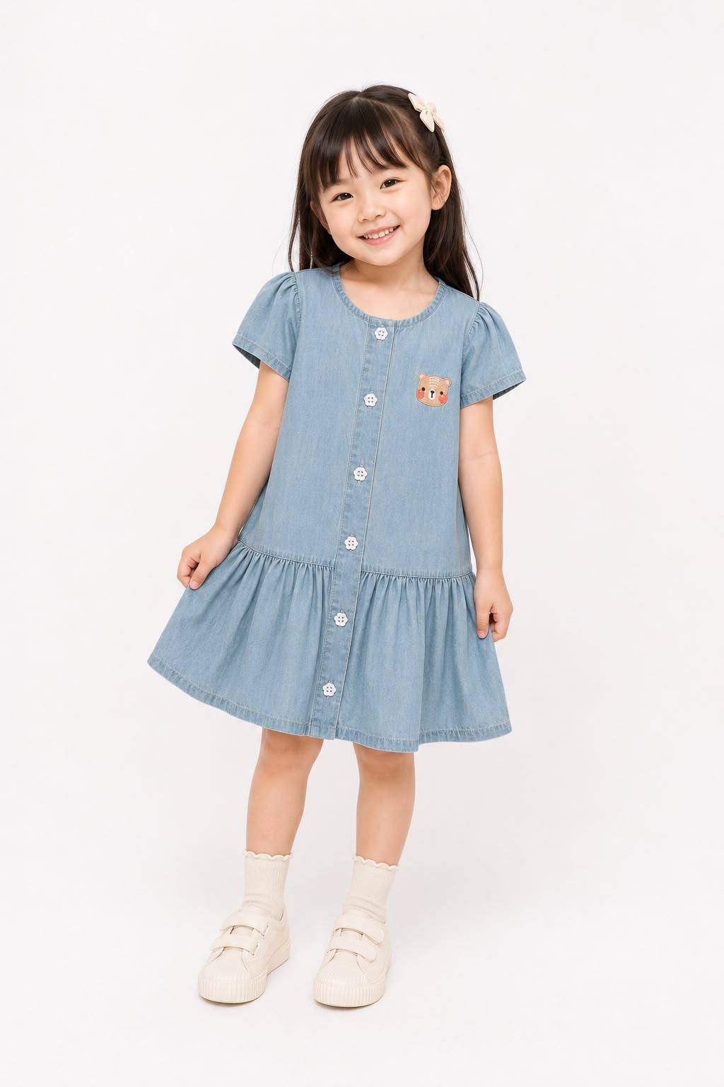 Girl wearing little bloom denim dress taking photoshoot