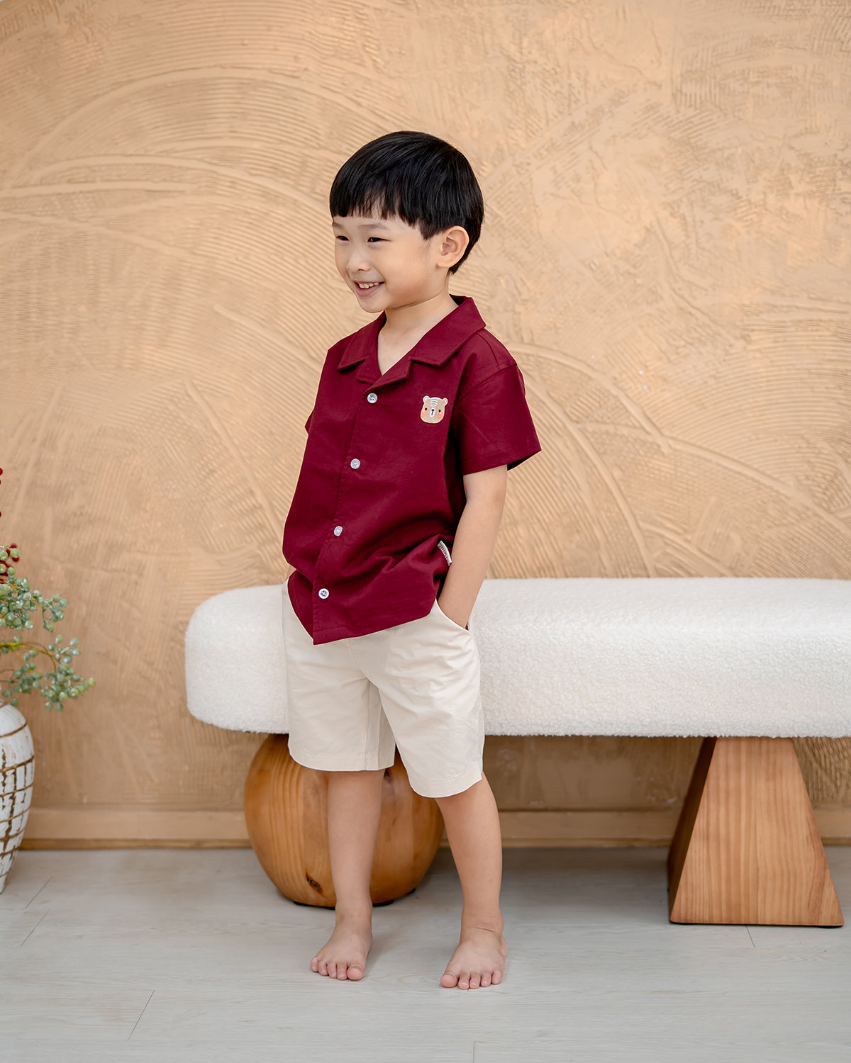 “Side angle of LeBear Maison Camp Collar Shirt for boys in Berry Rouge”
