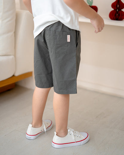Back view of Everyday Essential Shorts in Charcoal with LeBear label – kids neutral shorts