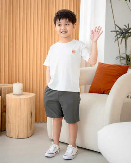 Full body shot of child in Charcoal Everyday Essential Shorts – neutral kids wear