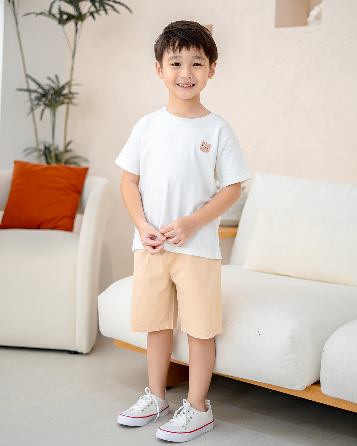 Full body shot of boy in Sand Dunes shorts and white tee – comfy kids daily wear