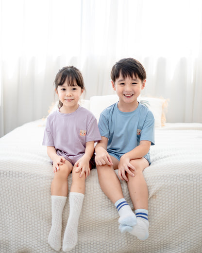 Children wearing lilac and skyblue loungewear crafted from breathable OEKO-TEX® certified TENCEL™ Lyocell fabric