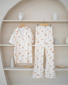 LeBear Adult Kaya Butter Toast Bamboo Pyjamas Pants Set displayed on hanger with button top and matching full-length pants.