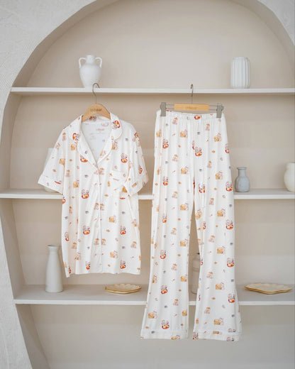 LeBear Adult Kaya Butter Toast Bamboo Pyjamas Pants Set displayed on hanger with button top and matching full-length pants.