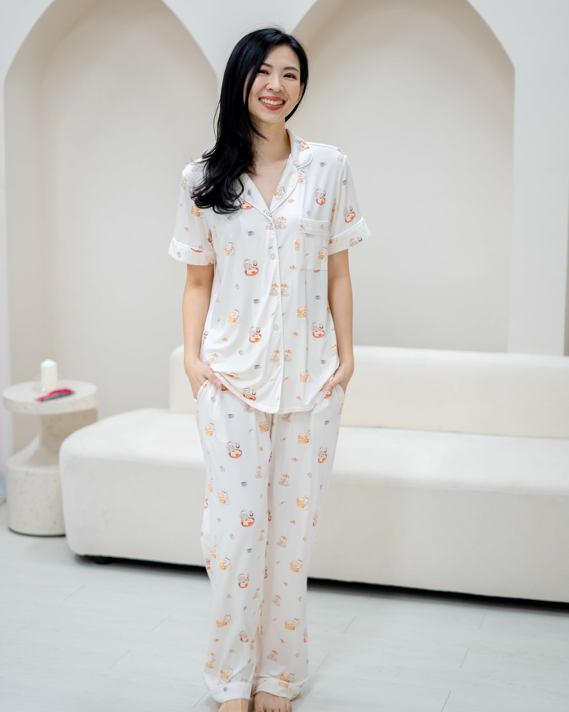 Alt text: Front view of woman wearing LeBear Adult Kaya Butter Toast Bamboo Pyjamas Pants Set with relaxed fit silhouette.