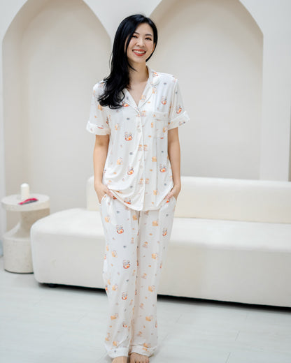 Alt text: Front view of woman wearing LeBear Adult Kaya Butter Toast Bamboo Pyjamas Pants Set with relaxed fit silhouette.