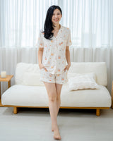 Woman standing in LeBear Adult Kaya Butter Toast Bamboo Pyjamas Shorts Set featuring relaxed fit and playful breakfast print.