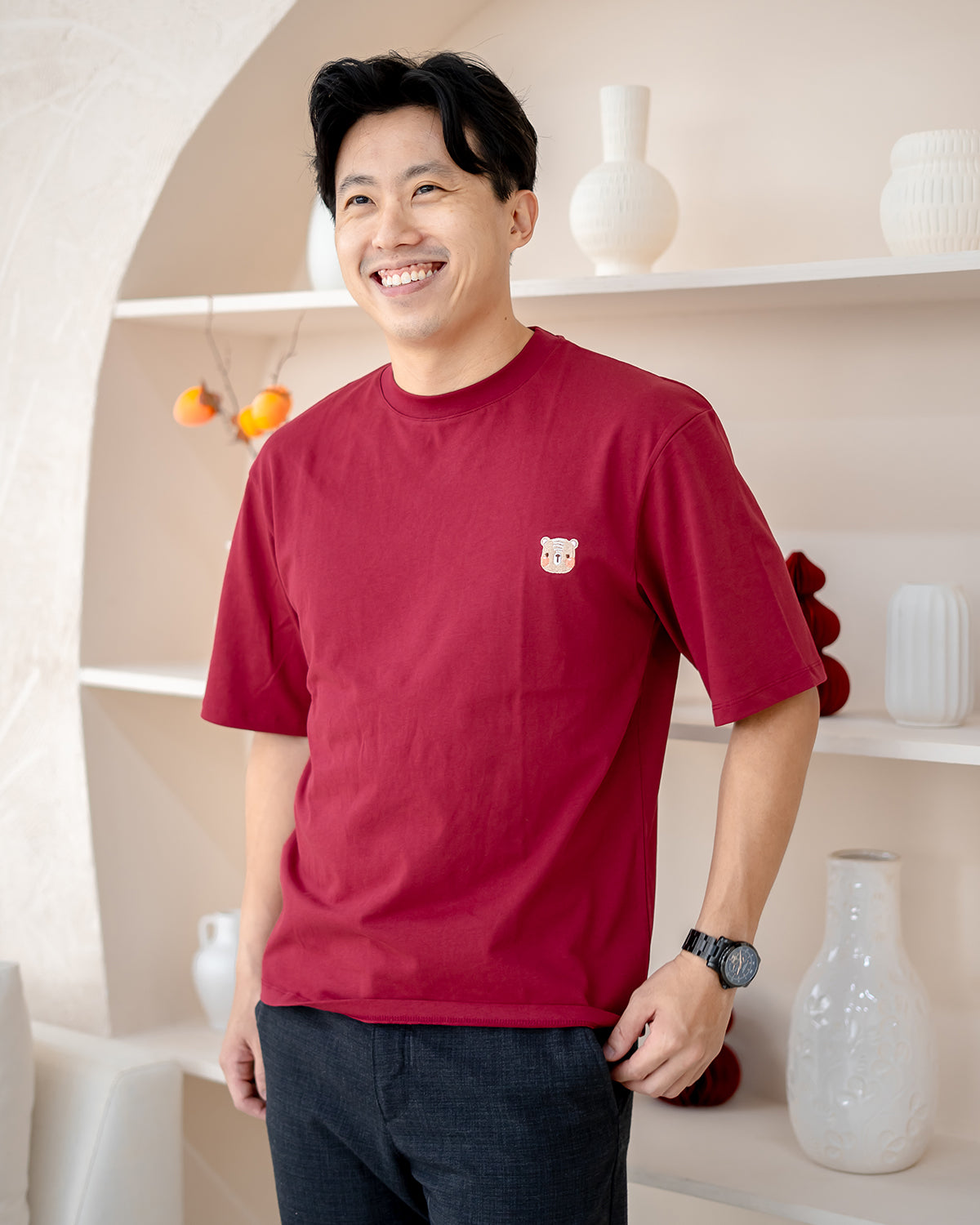 Smiling man in LEBEAR oversized red tee – breathable premium cotton CNY top
