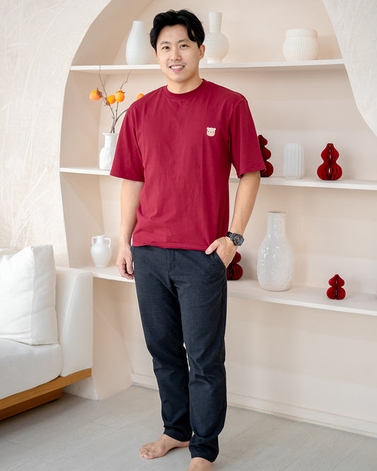 Man wearing LEBEAR Adult Oversized Tee in Red – signature bear embroidery