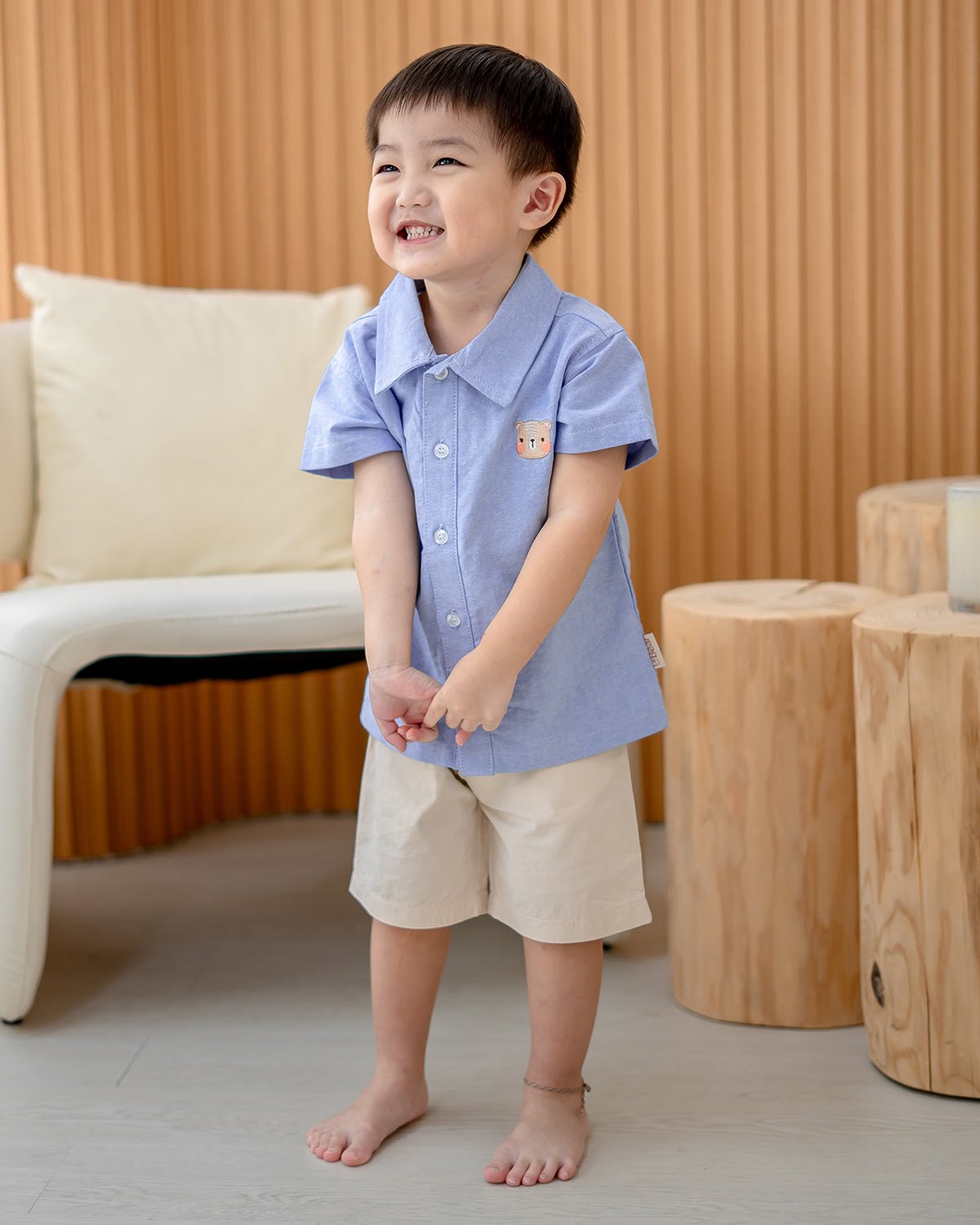 Smiling boy in LeBear 100% cotton Atelier Button Down Shirt Blue