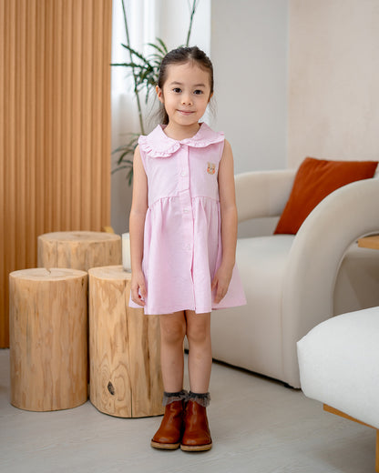 “Girl wearing LeBear Atelier Ruffle Collar Dress in Pink – 100% cotton front view”