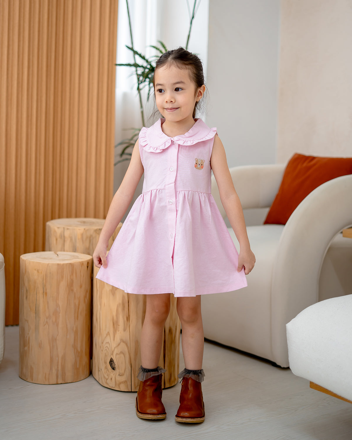 “Girl twirling in LeBear Atelier Ruffle Dress – premium cotton tagless girls outfit”