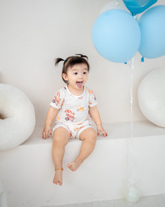 Baby in Uncle Bear Ice Cream Truck TENCEL™ onesie with playful bear print