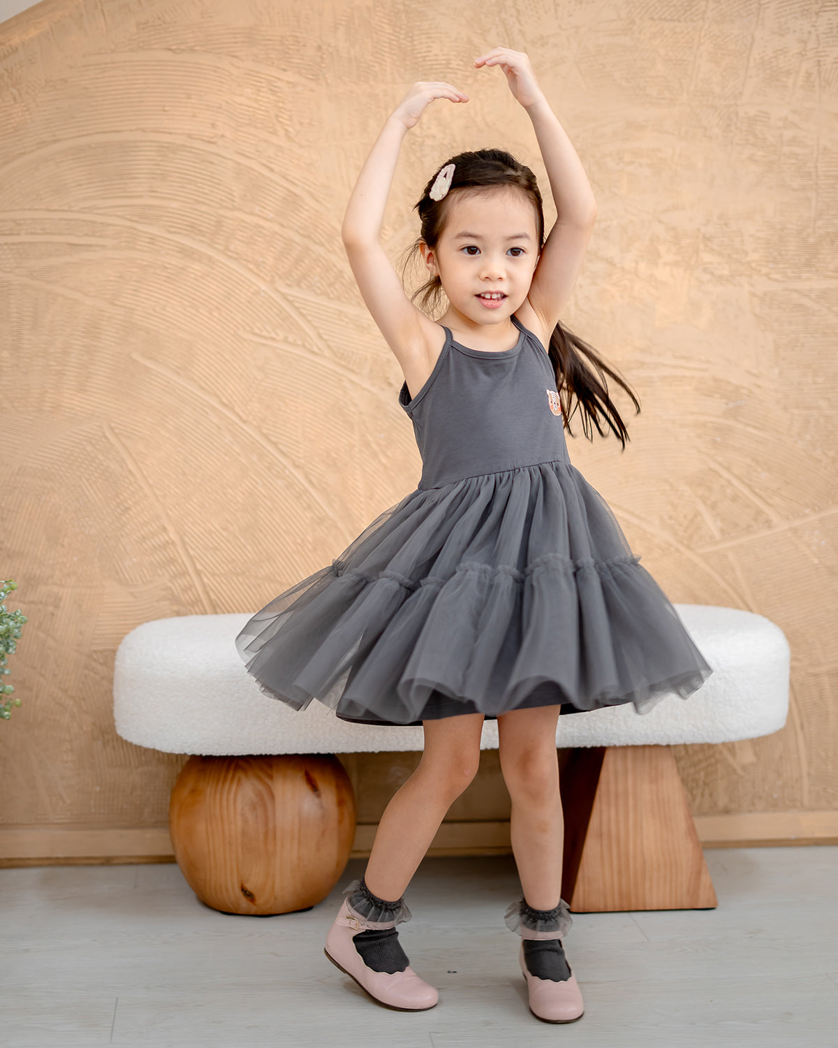 “Child twirling in LeBear TENCEL blend Ballet Tulle Dress with triple-layer skirt”