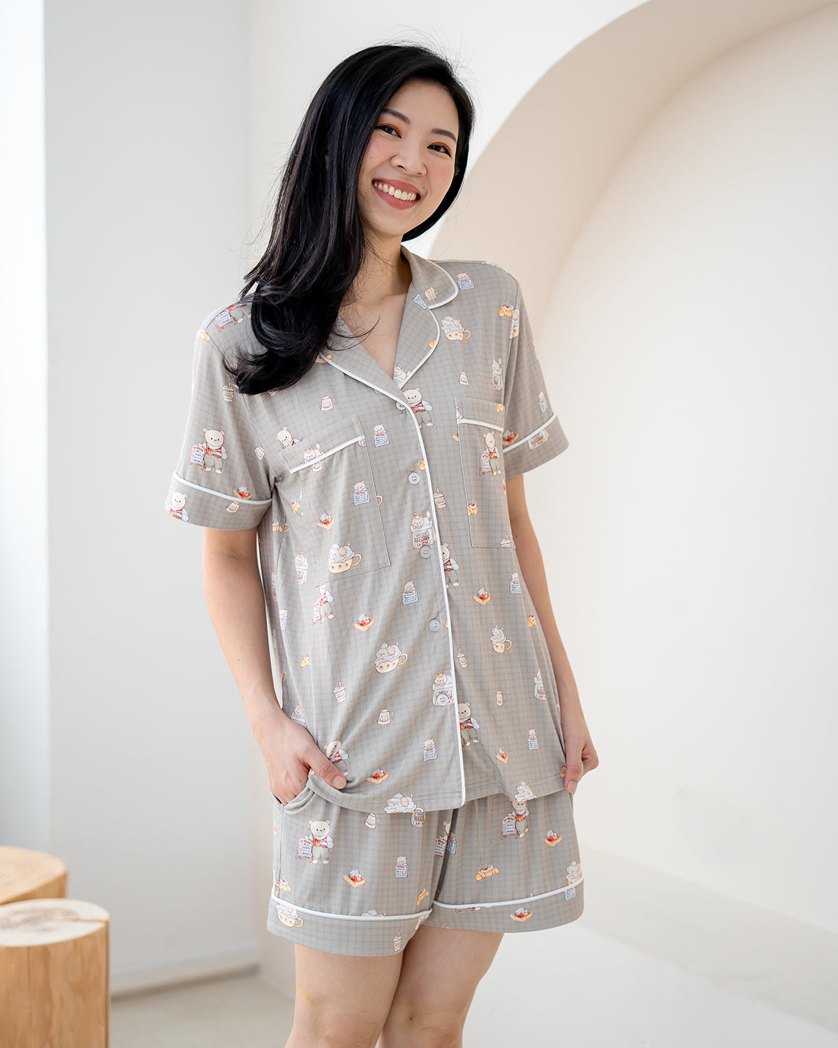 Lifestyle photo of LeBear Bearista adult bamboo pyjamas with breathable bamboo fabric and signature café bear illustrations.
