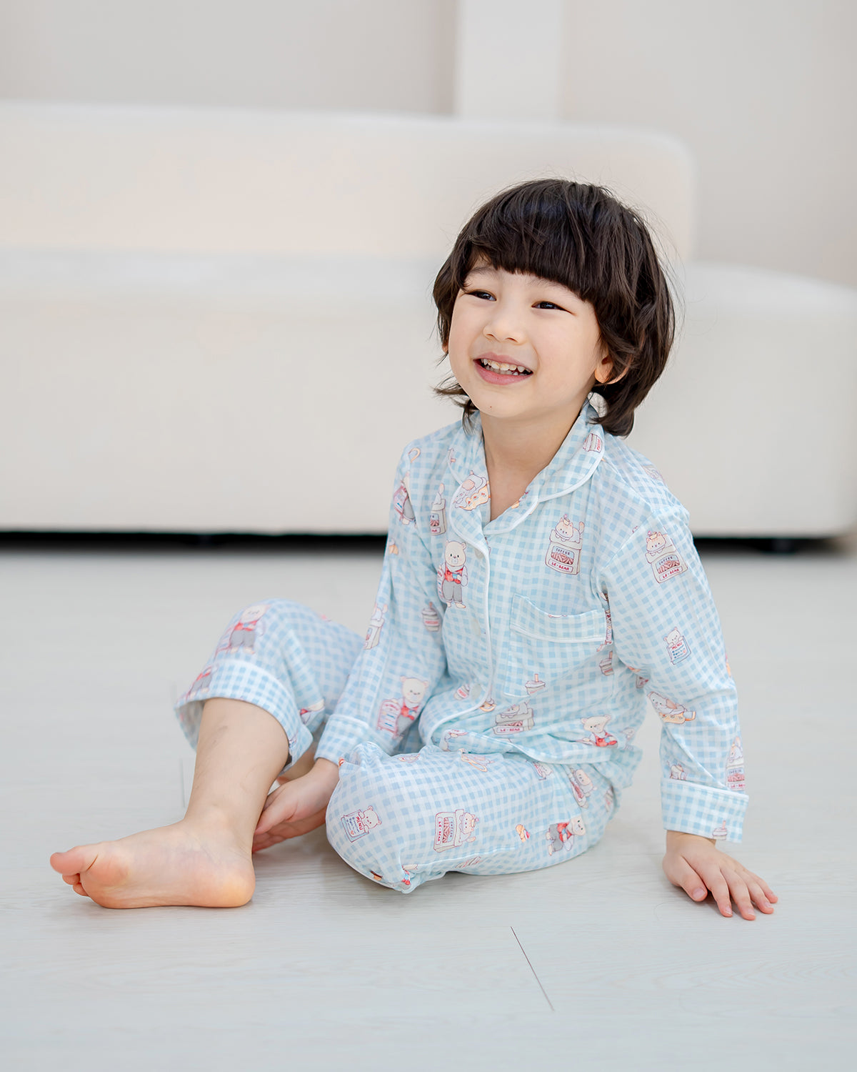 Child wearing LeBear Bearista Bluebell Gingham bamboo pyjamas with a soft, breathable and comfortable fit.