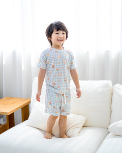 Child wearing LeBear Bearista Bluebell Gingham short sleeve bamboo lounge set, perfect for comfortable everyday lounging.