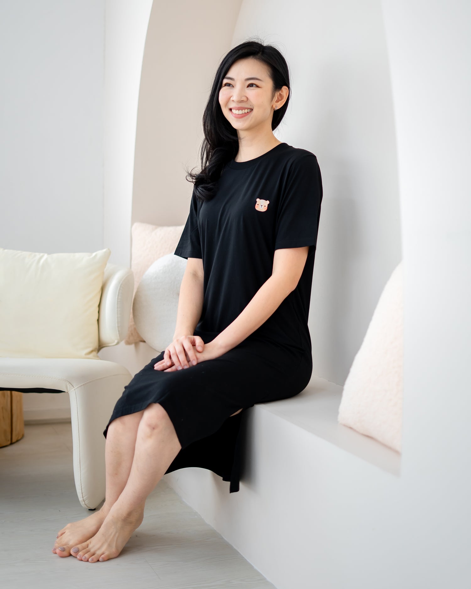 LeBear Easy Slit TENCEL™ Dress black sitting lifestyle shot comfortable breathable soft women home lounge dress