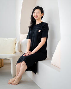 LeBear Easy Slit TENCEL™ Dress black sitting lifestyle shot comfortable breathable soft women home lounge dress
