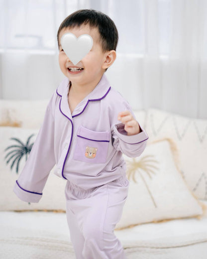 Toddler wearing LeBear × Em Obsessed OEKO-TEX® bamboo lavender family matching pyjamas playing indoors