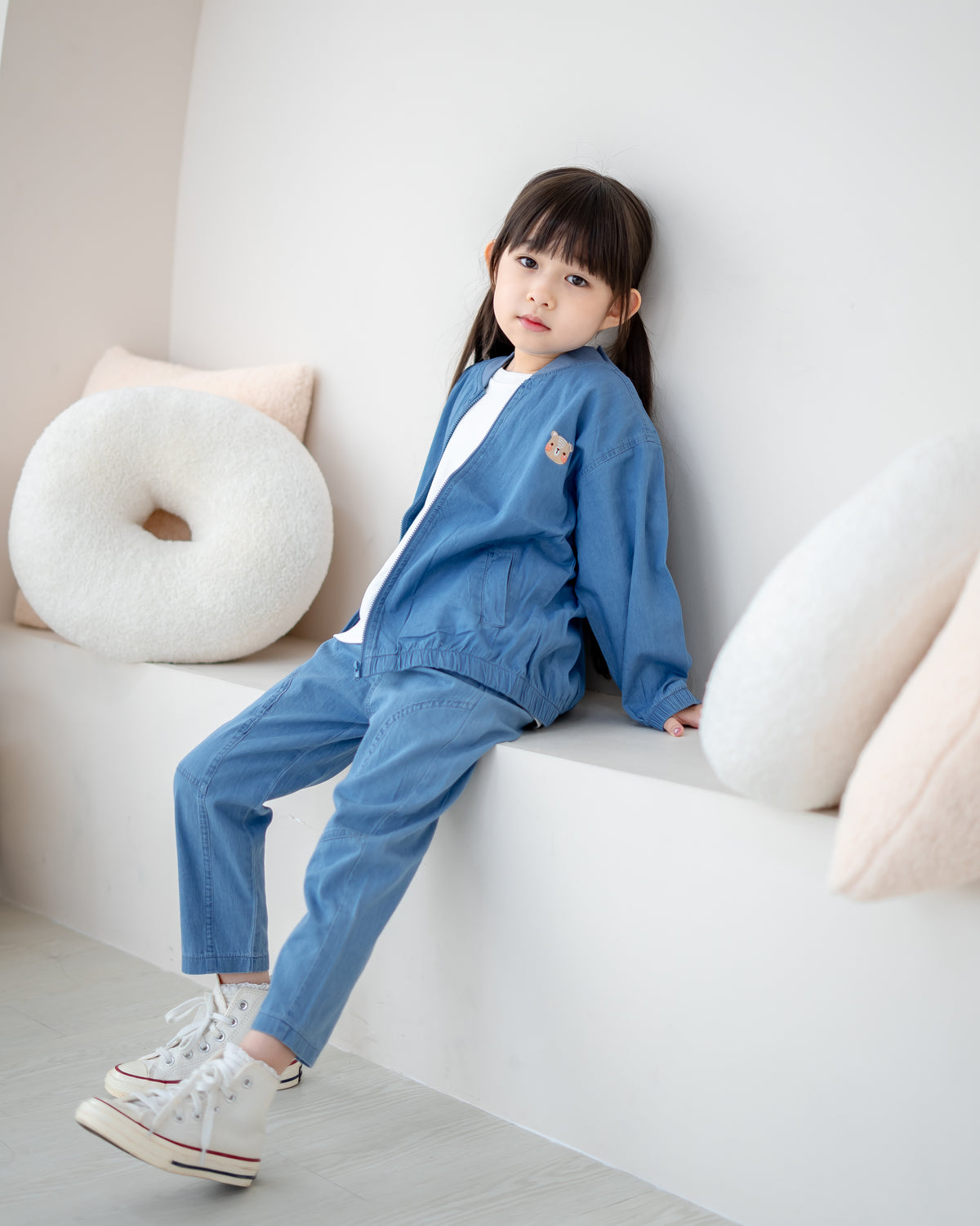 Girl wearing LeBear Little Nomad Denim Bomber Jacket with matching denim pants