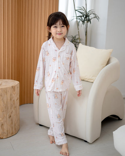 Child wearing LeBear Ice Cream Bear pink gingham bamboo pyjamas designed for family matching sleepwear