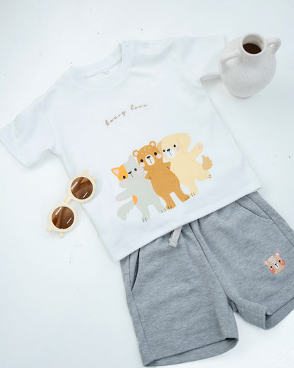 LeBear Kids Bear Friends Tee in white paired with grey bear embroidered shorts, flat lay outfit styling