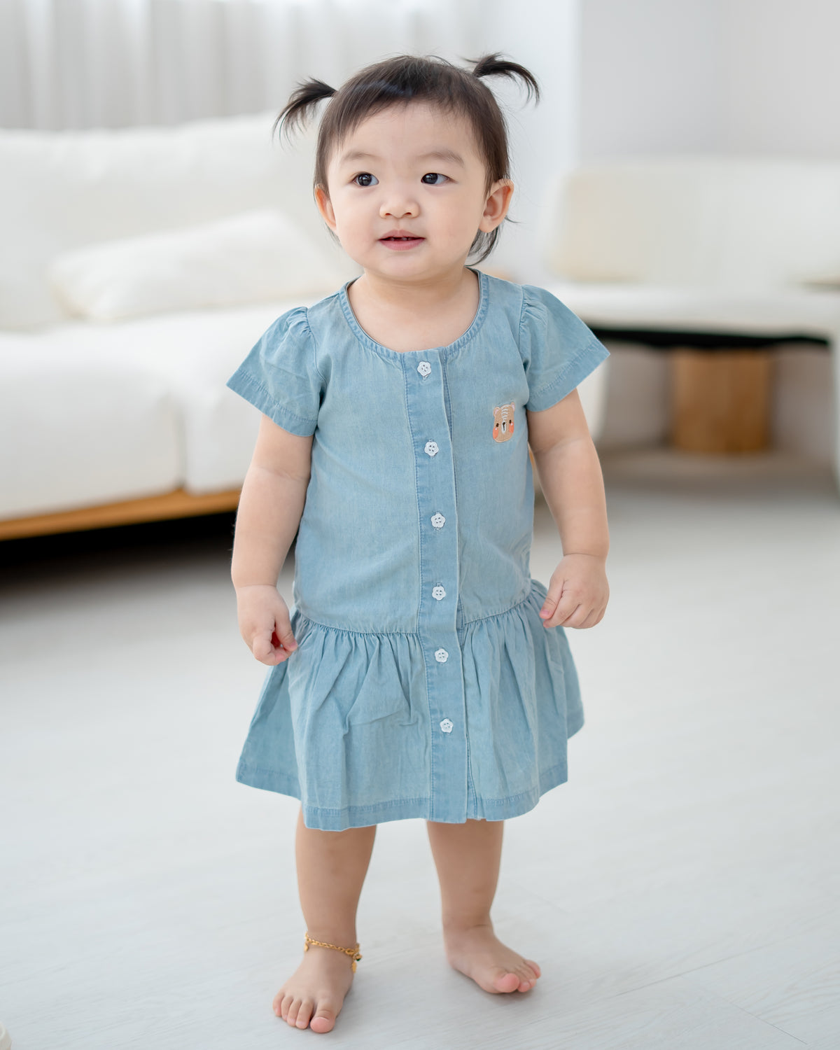 LeBear kids denim dress with signature bear embroidery and button-down front