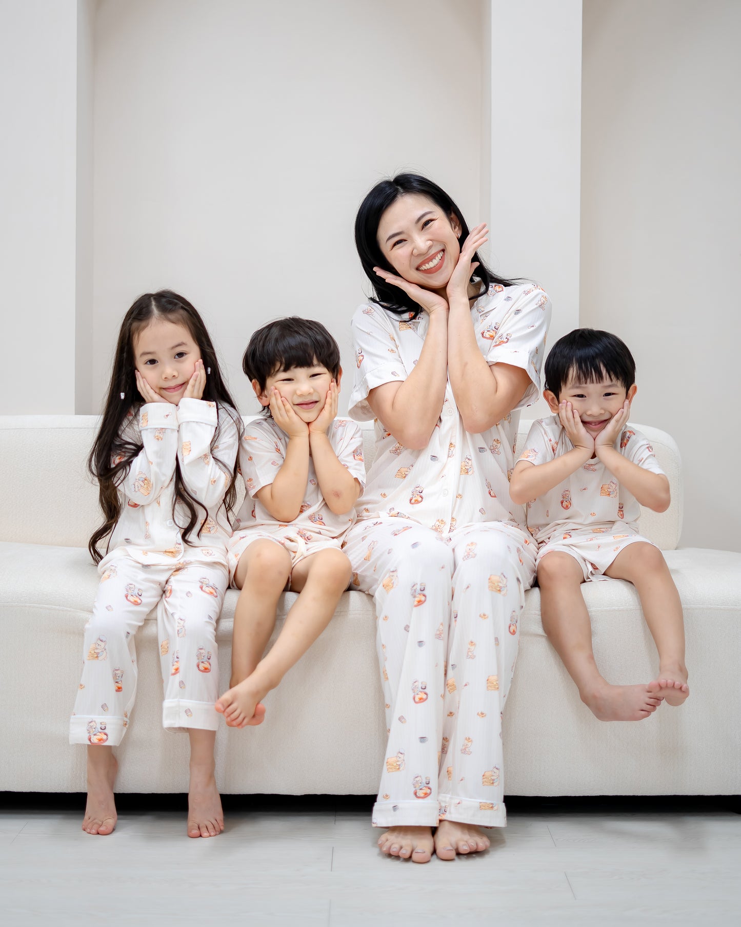 Family wearing matching LeBear Kids Kaya Butter Toast Bamboo Pyjamas Set with playful Singapore breakfast print.