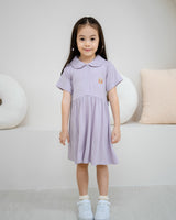 Full body front view of girl wearing LeBear Kids TENCEL™ Collar Dress in Lilac with elegant relaxed silhouette.