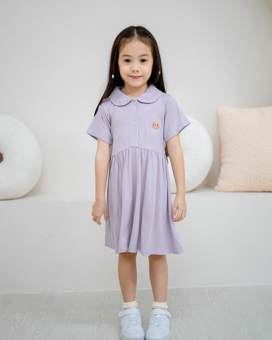 Full body front view of girl wearing LeBear Kids TENCEL™ Collar Dress in Lilac with elegant relaxed silhouette.