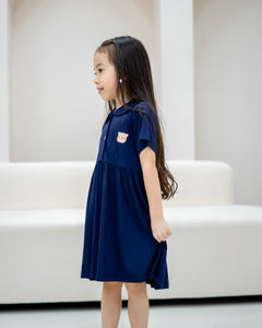 Side profile of child wearing LeBear Kids TENCEL™ Collar Dress in Navy showing soft drape and relaxed fit.