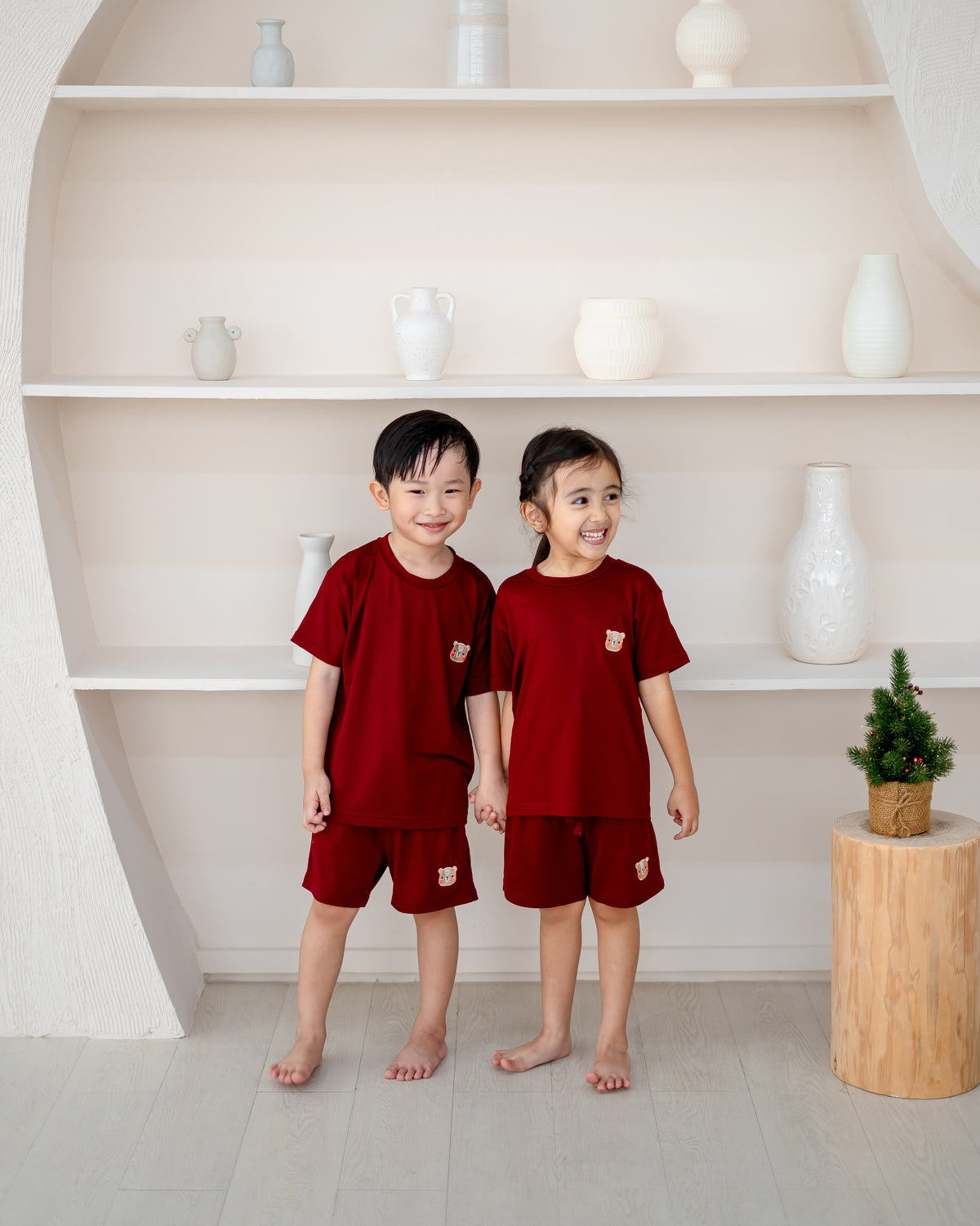 Kids wearing matching LeBear TENCEL™ Lounge Sets in Ruby