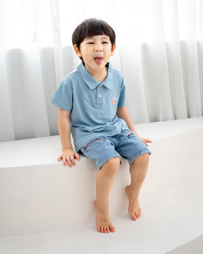 LeBear kids TENCEL™ polo shirt light blue sitting playful boy soft breathable pastel kids clothing Singapore